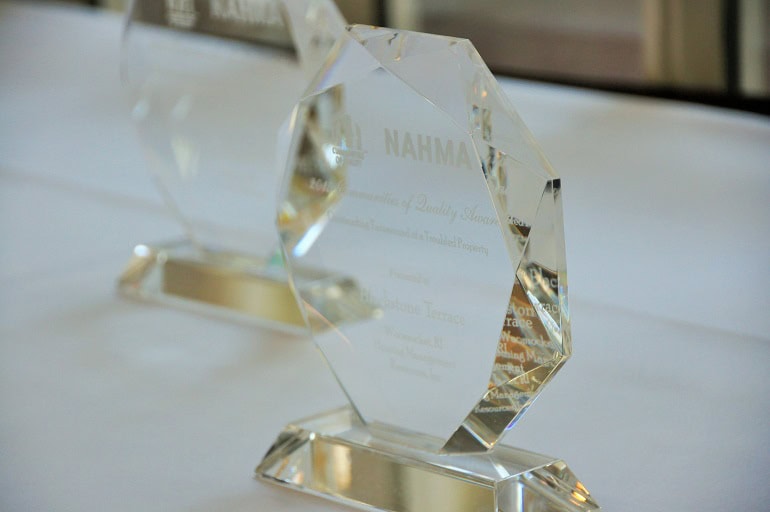 NAHMA award crystal trophy on display with soft focus background.